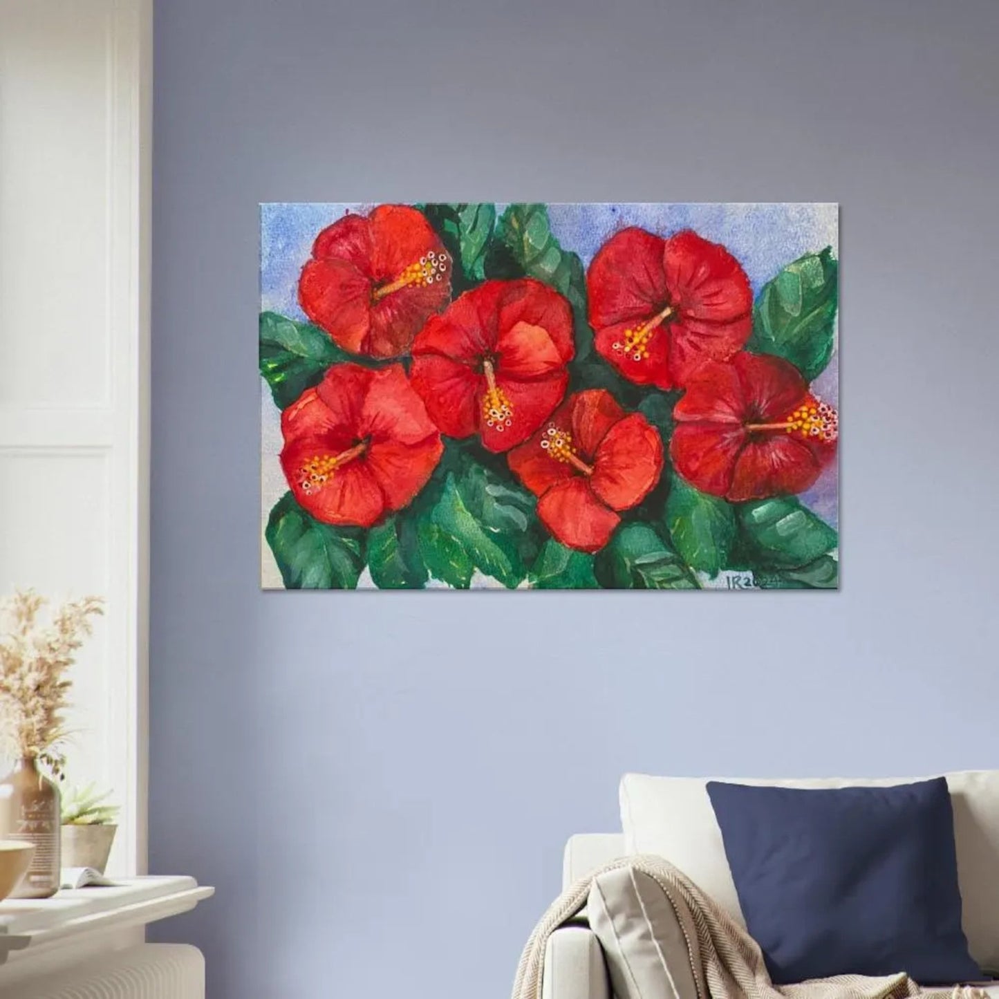 Hibiscus wall art flowers canvas art print hanging in living room.