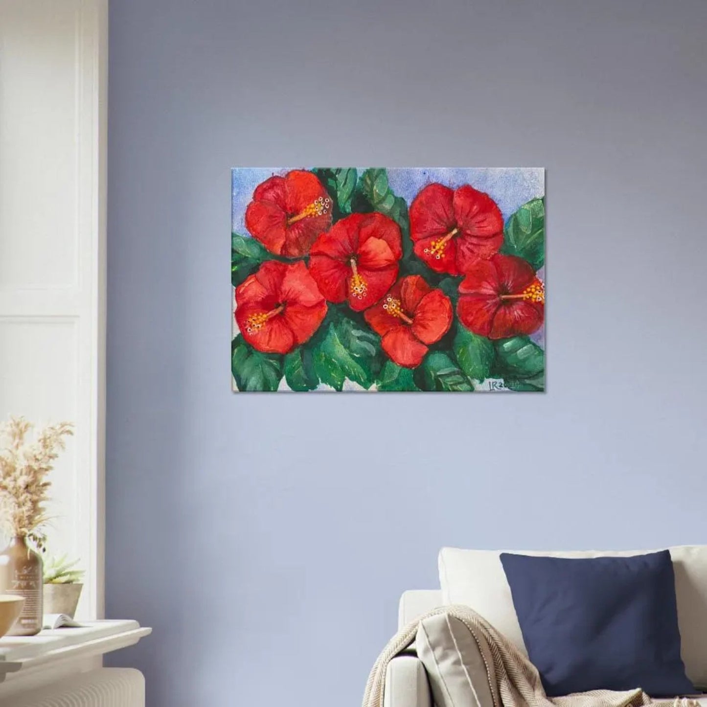 Hibiscus wall art flowers canvas print ready-to-hang on blue wall.